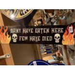 A METAL 'MANY HAVE EATEN, FEW HAVE DIED' MAN CAVE SIGN