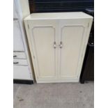 A CREAM AND GILT TWO DOOR MODERN WARDROBE, 33" WIDE