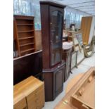 A MAHOGANY CORNER CABINET WITH LOWER DOOR AND UPPER GLAZED DOOR