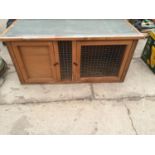 A WOODEN RABBIT HUTCH