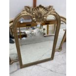 AN ORNATE GILT FRAMED MIRROR