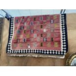 A RED PATTERNED RUG