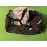 A LARGE BLACK AND GREY REEBOK HOLDALL