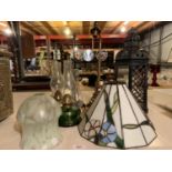 A GROUP OF TABLE LIGHTS TO INCLUDE A LARGE METAL CANDLE HOLDER AND TWO GLASS OIL LAMPS