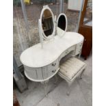 A MODERN CREAM AND GILT KIDNEY SHAPED DRESSING TABLE WITH TRIPLE MIRROR AND STOOL