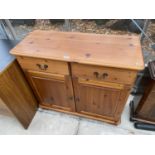 A MODERN PINE DRESSER BASE, 38" WIDE, ENCLOSING TWO DRAWERS AND TWO CUPBOARDS