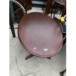 AN OVAL MAHOGANY COFFEE TABLE