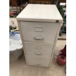 A THREE DRAWER METAL FILING CABINET WITH KEY