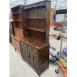 A REPRODUCTION OAK DRESSER COMPLETE WITH PLATE RACK, 36" WIDE