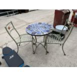 A MOSAIC PATIO TABLE AND TWO CHAIRS