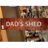 A METAL 'DADS SHED' SIGN