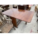 AN OAK DROP LEAF DINING TABLE