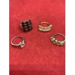 FOUR ASSORTED SILVER RINGS