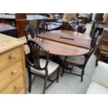 A MAHOGANY EXTENDING DINING TABLE ON TWIN PEDESTAL SUPPORTS WITH SIX SHIELD BACK DINING CHAIRS