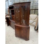 A REPRODUCTION MAHOGANY BOWFRONTED CORNER CUPBOARD
