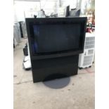 A 34" BANG AND OLUFSEN TELEVISION WITH BUILT IN STAND AND REMOTE CONTROL