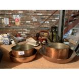 A FOUR PIECE SET OF VINTAGE TIN LINED COPPER PANS