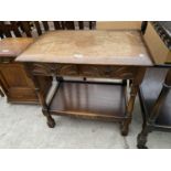 AN OAK SIDE TABLE WITH TWO DRAWERS