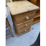 A PINE BEDSIDE CHEST OF THREE DRAWERS