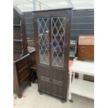 A PRIORY STYLE GLAZED AND LEADED CORNER CUPBOARD, 27" WIDE