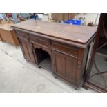 A VICTORIAN MAINLY OAK KITCHEN DRESSER ENCLOSING TWO CUPBOARDS, THREE DRAWERS AND AN OPEN CENTRE