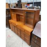 A RETRO TEAK CABINET WITH THREE DOORS, THREE DRAWERS AND TWO UPPER DOORS