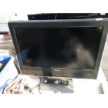 A 26" TOSHIBA TELEVISION WITH REMOTE CONTROL