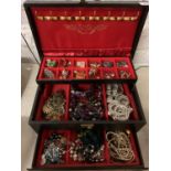 A THREE TIER JEWELLERY BOX TO INCLUDE THE COSTUME JEWELLERY CONTENTS