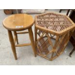 A BEECH STOOL AND A SMALL WICKER TABLE