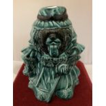 A PILKINGTONS LANCASTRIAN POTTERY MONEYBOX IN THE FORM OF AN OLD ENGLISH SHEEP DOG IN TEAL GREEN