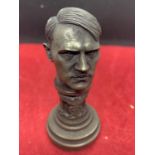 A BRASS GERMAN HITLER FIGURE WITH STAMP