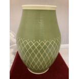 A PILKINGTONS LANCASTRIAN POTTERY VASE CREAM BACKGROUND WITH GREEN OVER GLAZE INCISED WITH