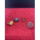 FOUR ASSORTED DECORATIVE SILVER RINGS