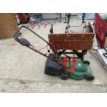 A QUALCAST ELECTRIC LAWNMOWER AND A WORKMATE BENCH