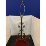 A VINTAGE METAL WESCAL LIGHT ON A WOODEN PLINTH