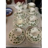 A COLCLOUGH IVY DESIGN SIX TRIO TEA SET TO INCLUDE DESSERT BOWLS