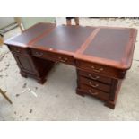 A GEORGIAN STYLE TWIN PEDESTAL PARTNERS DESK ENCLOSING TWELVE DRAWERS AND TWO CUPBOARDS, WITH