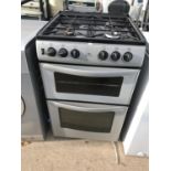 A GREY AND BLACK NEWWORLD FREE STANDING ELECTRIC OVEN WITH GAS HOB