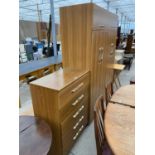 A TEAK EFFECT CHEST OF FIVE DRAWERS AND MATCHING WARDROBE