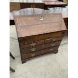 A 19TH CENTURY OAK BUREAU WITH FALL FRONT, TWO SHORT AND TWO LONG DRAWERS AND INNER DRAWERS AND