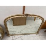 AN ORNATE GILT FRAMED MIRROR