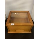 A WOODEN COUNTER TOP DISPLAY CABINET WITH SINGLE DRAW