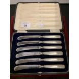 A VELVET LINED BOXED SET OF SIX SILVER HALLMARKED CAKE KNIVES