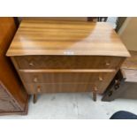 A RETRO TEAK CHEST OF THREE DRAWERS