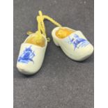 A MINATURE PAIR OF DELPH CLOGS