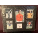 FIVE PHOTOGRAPHS OF JOHAN CRUYFF WITH HIS AUTOGRAPH IN A MOUNT COMPLETE WITH CERTIFICATE OF