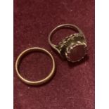 TWO 9 CARAT GOLD RINGS TO INCLUDE A PLAIN BAND AND A COIN