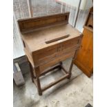 A 19TH CENTURY OAK OFFERTORY BOX ON OPEN TURNED BASE, 24" WIDE