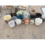 A LARGE QUANTITY OF CERAMIC AND GLASS PLANTERS AND VASES ETC