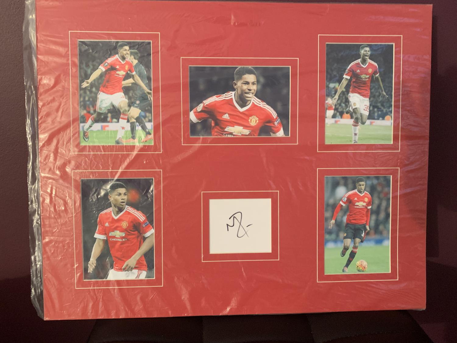 FIVE PHOTOGRAPHS OF MARCUS RASHFORD WITH HIS AUTOGRAPH IN A MOUNT COMPLETE WITH CERTIFICATE OF